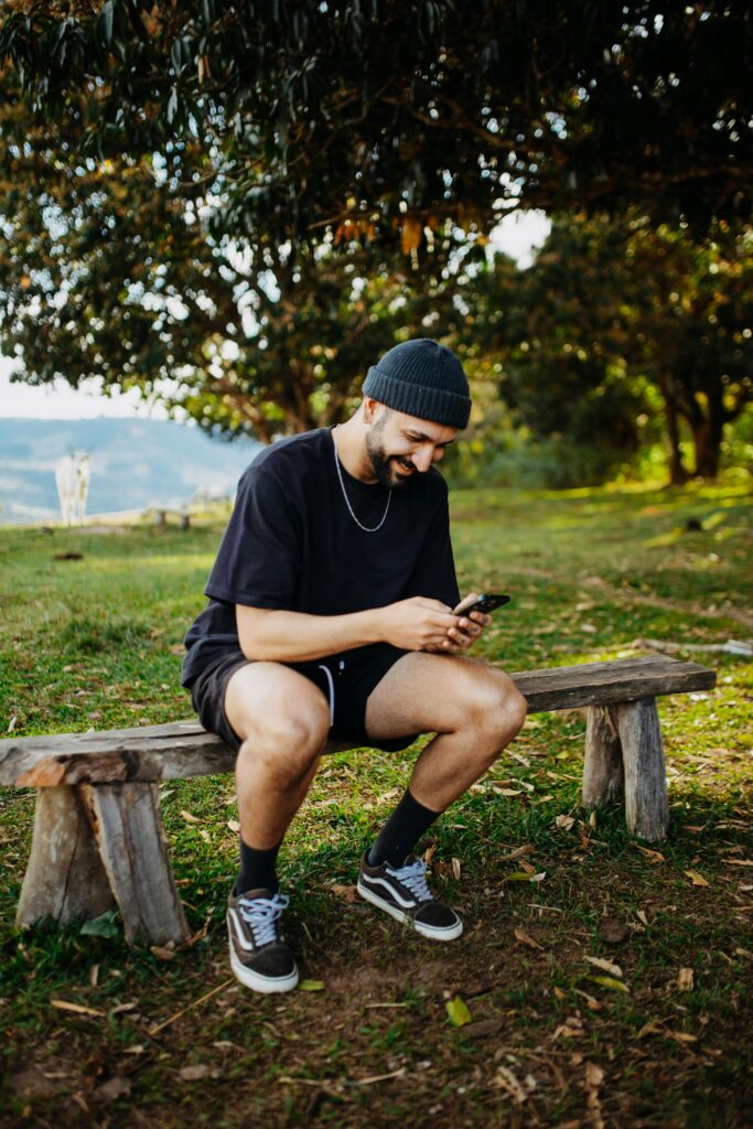 pexels-photo-17767229-17767229 Man in Warm Cap Holding Smartphone
